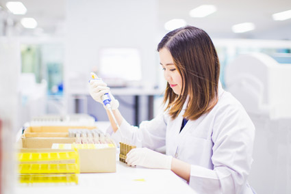 Woman pipetting